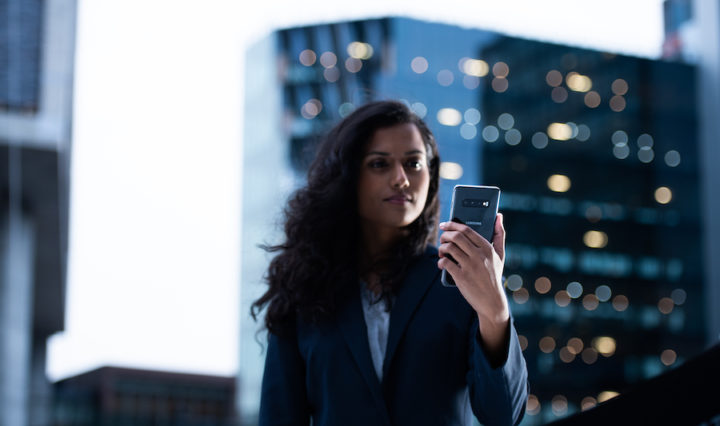 woman holding a Samsung S