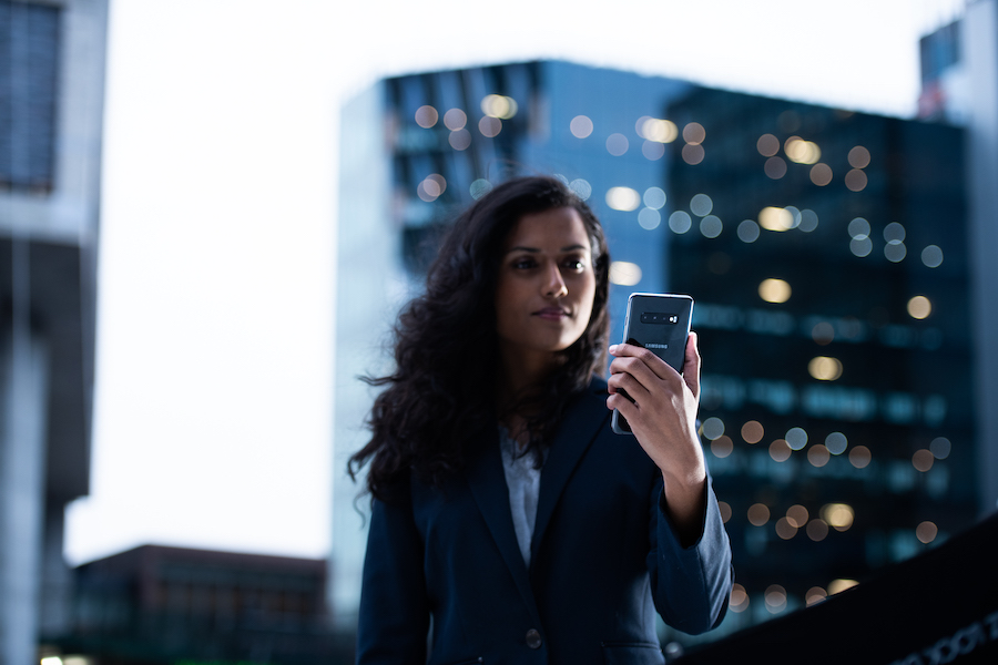 woman holding a Samsung S