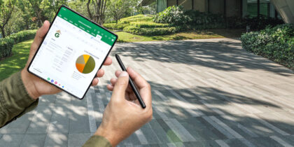 Galaxy Z Fold4 user with S Pen editing Excel sheet outside