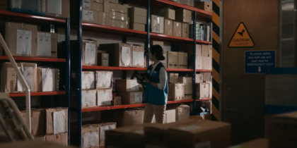 Worker in warehouse scanning boxes with Samsung Galaxy Tab Active4 Pro