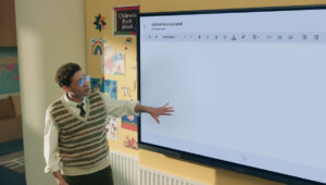 Teacher using Samsung interactive whiteboard to enhance lessons